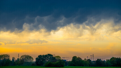 Fototapeta premium Ominous dark thunderclouds over landscape