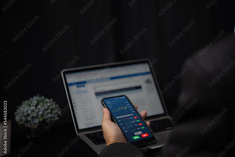 Aufkleber businessman trader smart phone with graphs analysis candle in office diagrams on screen.stock exchan