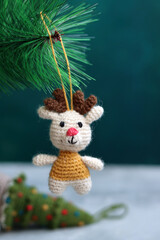 Cute hand made Christmas ornament. Crochet Reindeer close up photo. Cozy winter present ideas. 