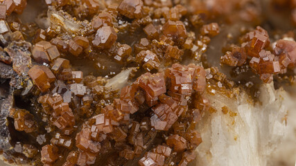 orange-red tabular crystals of vanadinite, lead ore belonging to the eighth class