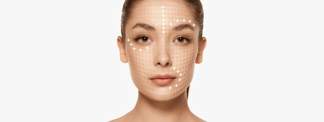 Close-up portrait of young beautiful woman with lifting lines, contour correction on face over...