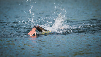 Triathlon Endurance Training Swimming at the lake in summer 