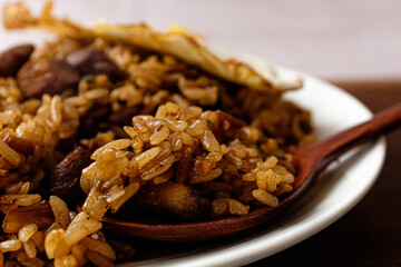 Nasi Goreng, stir-fried meat, vegetables and rice in sweet soy sauce