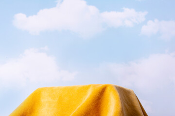 Yellow empty podium on blue sky in beautiful style . Summer light backdrop. Natural background for...