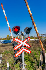 Railway traffic lights with a red signal. Railway and road crossing. Forbidding Motion signal.