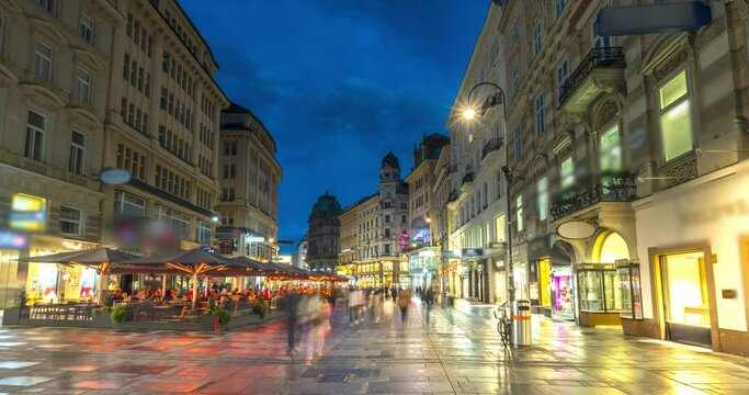 Pedestrian walking in Viennna main street Graben St. timelapse hyperlapse, old town main street of Vienna with many shops and restaurants, Austria. The Pestsaule Vienna square. shopping street.