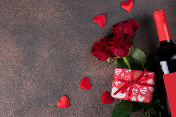 Roses, gifts and bottle of red wine, concept for Valentines Day, Top view, Copy space