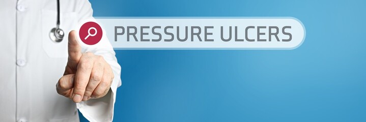 Pressure ulcers (bedsores). Doctor in smock points with his finger to a search box. The term is in focus. Symbol for illness, health, medicine - obrazy, fototapety, plakaty