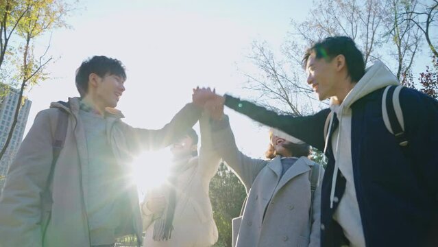 Happy Chinese college students cheering