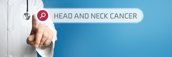 Head and neck cancer. Doctor in smock points with his finger to a search box. The term is in focus....
