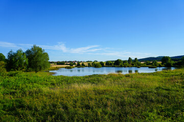Fototapeta na wymiar Glockenborn nature reserve in the Bründersen district near Wolfhagen. Landscape with wet meadows and small ponds. 