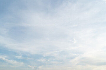 Beautiful blue sky bright midday sun with fluffy clouds. Summer sunshine with white cloudscape background. Natural scenic sunny day horizon sky wallpaper backdrop.