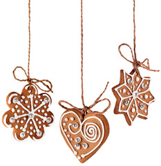 Three Christmas gingerbread cookies decoration hanging isolated