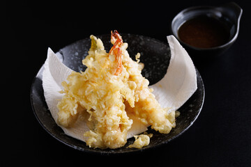 Shrimp tempura Japanese food isolated on a black background