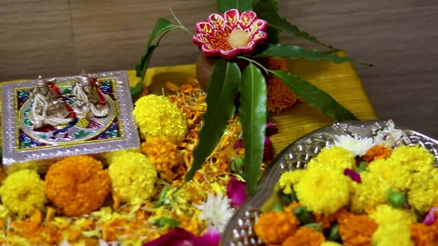hindu god religious ritual festive pray with flowers from flat angle