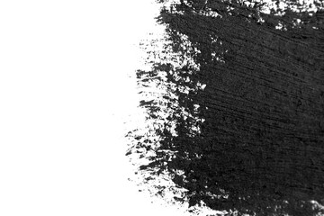 Brush strokes of black acrylic paint close-up. Edge of Smeared Acrylic Black Spot isolated on white background. Abstract creative background. Art drawing texture concept. Copy space, space for text