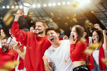 Group of happy thrilled excited soccer football fans cheering for their sport team victory. Concept of emotions, global sports competitions, championship