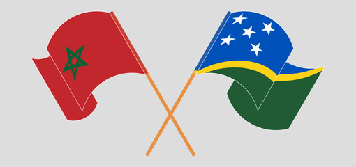 Crossed and waving flags of Morocco and Solomon Islands
