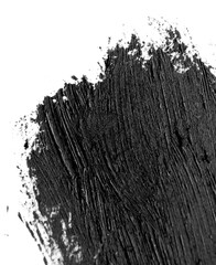 Brush strokes of black acrylic paint close-up. Edge of Smeared Acrylic Black Spot isolated on white background. Abstract creative background. Art drawing texture concept. Copy space, space for text