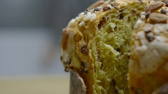 Traditional Italian homemade Christmas panettone typical of Milan with almonds, chocolate drops and sugar