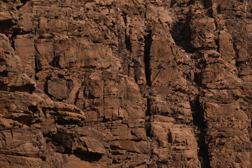Entrance to the Wadi Mujib canyon in Jordan. Steep rocks and a rapid flowing river carved. Difficult crossing and attraction for tourists on the water route.