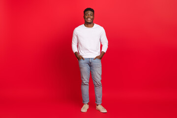 Full length photo of cheerful good mood attractive male wear trendy fashionable clothes isolated on...