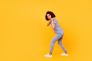 Fototapeta na wymiar Full body profile photo of unsatisfied hardworking lady arms hold pull empty space isolated on yellow color background