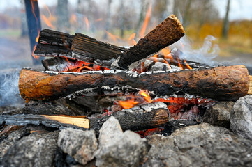 small fire at fireplace near walking trail Kumla Sweden