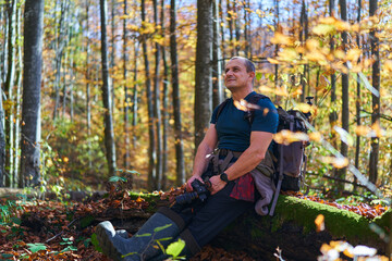 Nature photographer hiking with backpack