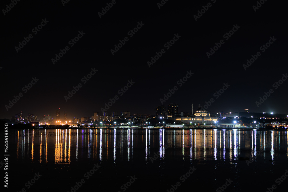 Wall mural night sky and light over the sea. silhouette of the city of istanbul.