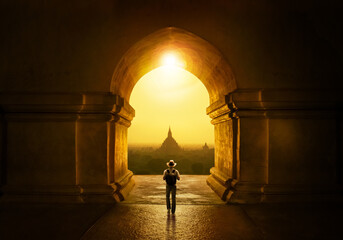 Backpacking tourist in a Bagan temple - obrazy, fototapety, plakaty