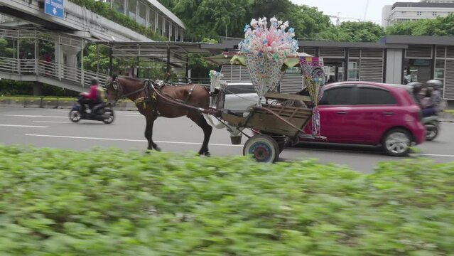 Horse Carriage or "Delman" in Indonesian on a Street in Downtown Jakarta