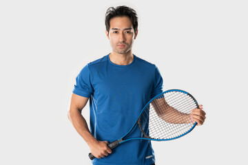 A male tennis player holding a tennis racket with a determined expression and eyes.