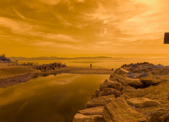 Obraz premium Infrared photography, view against the sun of Riotorto beach in the Gulf of Follonica, Tuscany Italy