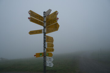 Swiss hiking way sign in the fog (Gamplüt)