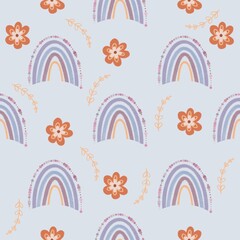 Boho rainbow seamless pattern. Boho rainbow with flower and leaf isolated on pastel blue background.