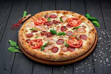 Pizza with mozzarella cheese, salami and chicken meat