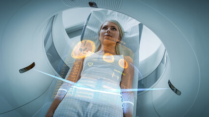 Female Patient Lying on a CT or PET or MRI Scan Bed, Moving Inside the Machine While it Scans Her...