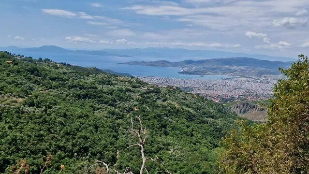 View of Volos seaside city from the traditional greek village of Makrinitsa on Pelion mountain in central Greece on a summer day
