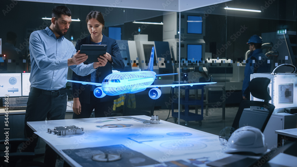 Poster aeronautics factory office meeting room: engineer holds tablet computer, showing augmented reality a