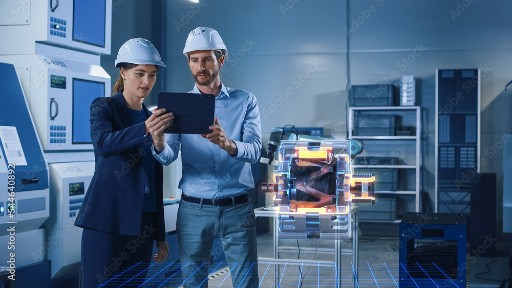 Poster factory office facility: chief engineer holds tablet computer, shows augmented reality model of elec