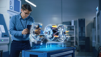 Factory Office Facility: Chief Engineer Developer Holds Tablet Computer, Examins Augmented Reality...