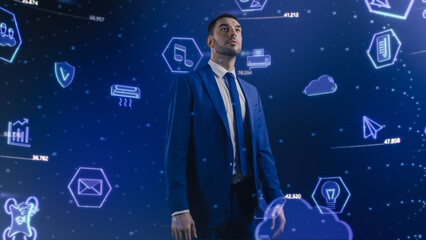 Augmented Virtual Reality Concept: Businessman in 3D World Surrounded by e-Business, e-Commerce, Email, Internet, IOT, Communications, Marketing Icons Flying around Confident Man.