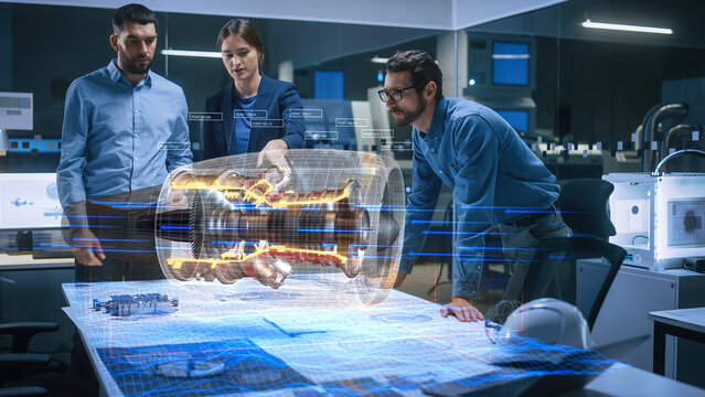 Aeronautics Factory Meeting Room: Team of Diverse Engineers and Managers Work on an Augmented Reality Airplane Jet Engine Simulation. Advanced Industry 4.0 Research and Development.