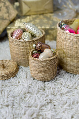 Vintage Christmas glass decorations in round baskets.