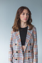 Fototapeta premium Beautiful gorgeous young girl in suit. Close up brunette woman portrait