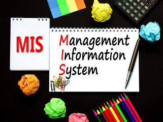 MIS management information system symbol. Concept words MIS management information system on white note on a beautiful black background. Business MIS management information system concept. Copy space © Dzmitry