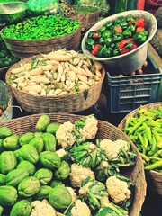 Vegetables in market.Cabbage,radish,chilli,capsicum in baskets