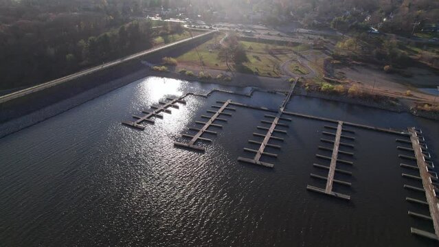Empty wooden harbor at lake and reservoir that has no boats, ships, or recreational vehicles docked at a Midwestern Ohio town