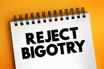 Reject Bigotry text on notepad, concept background